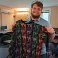 Trevor Cain'24 with one of Bob Elder's vintage patterned sweaters